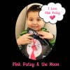pink patsy and the moon x Young child smiling while holding a copy of Pink Patsy and the Moon.