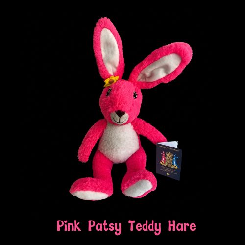 Pink Patsy Teddy Hara soft plush hare with Pink Patsy Passport on a black background.