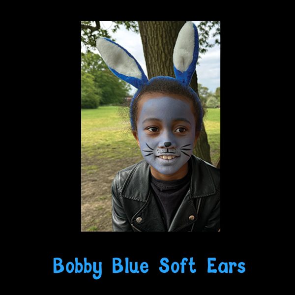 Bobby Blue Soft Ears dress-up in the park Child wearing Bobby Blue Soft Ears with blue bunny face paint in the park