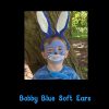 Bobby Blue Soft Ears worn with bunny face paint Child wearing Bobby Blue Soft Ears with blue bunny face paint, holding a Bobby Blue teddy