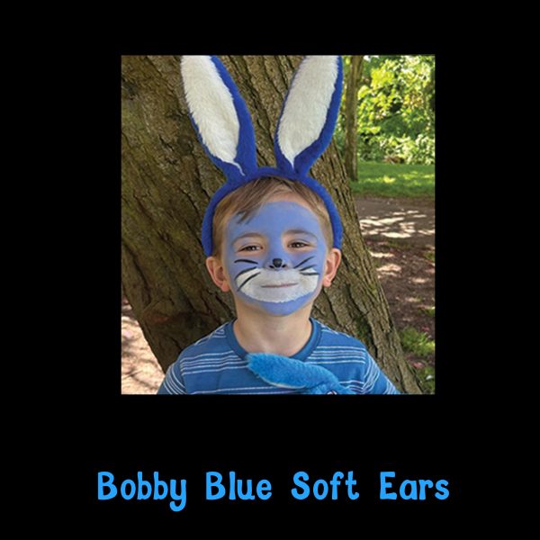 Bobby Blue Soft Ears worn with bunny face paint Child wearing Bobby Blue Soft Ears with blue bunny face paint, holding a Bobby Blue teddy