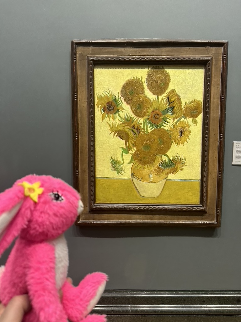 Pink Patsy looking at the Sunflowers painting by Vincent van Gogh at the National Gallery in London