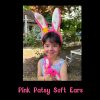 Pink Patsy Soft Ears with the Pink Patsy Teddy Hare Child wearing Pink Patsy Soft Ears with bunny face paint, cuddling a Pink Patsy Teddy Hare