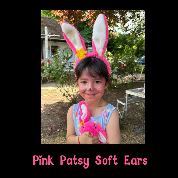 Pink Patsy Soft Ears with the Pink Patsy Teddy Hare Child wearing Pink Patsy Soft Ears with bunny face paint, cuddling a Pink Patsy Teddy Hare